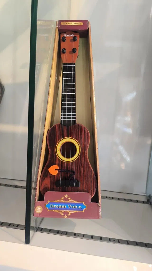 Mini Wooden Finish Plastic Guitar Music Instrument with 4 strings Clear sound  I kartnovastore.com