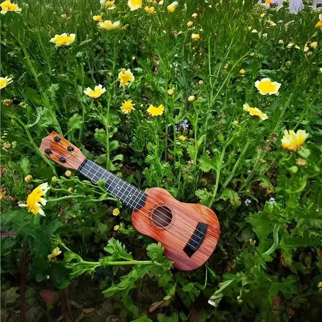 Mini Wooden Finish Plastic Guitar Music Instrument with 4 strings Clear sound  I kartnovastore.com